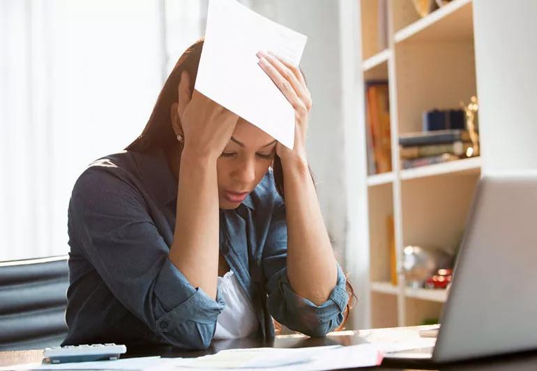 woman stressed out while at computer