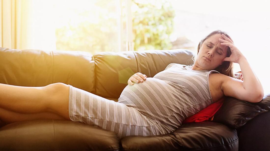 Pregnant woman on couch