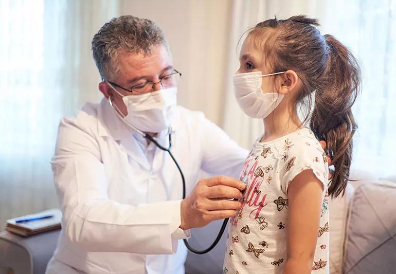 Doctor listening to a child's heart with a stethoscope