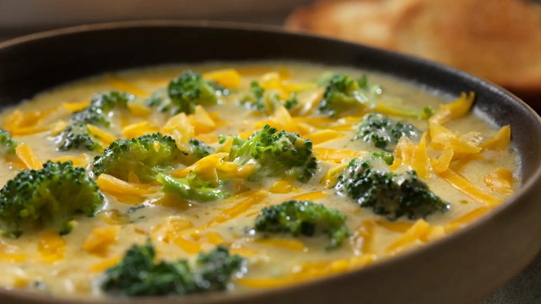 Bowl of creamy broccoli soup with cheese