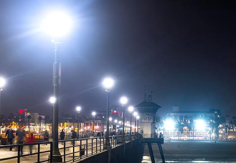 Street lights at night with flaring or halos around the brightness of the lights.