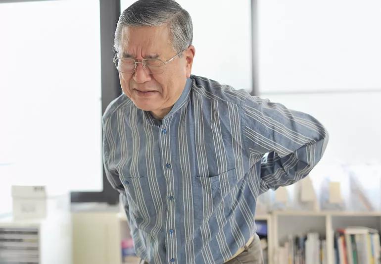 Older man with severe back pain