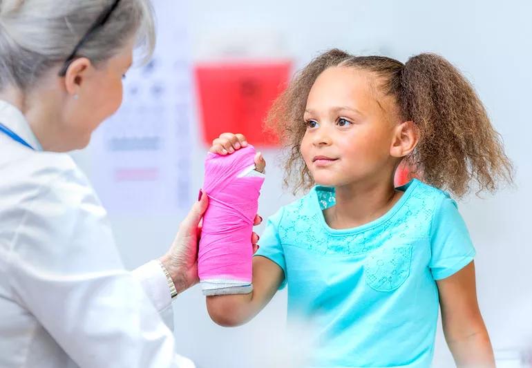 Child getting a cast on her broken arm