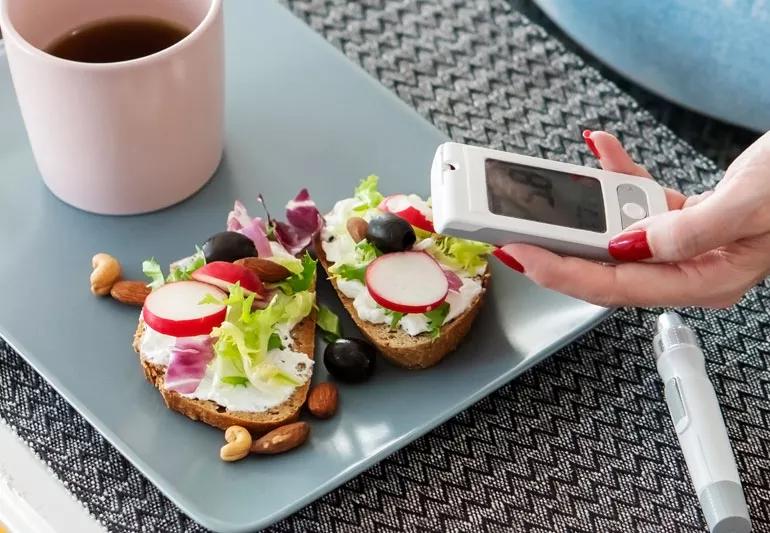 woman eating healthy and checking her insulin levels