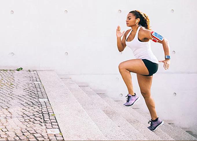 woman running up steps