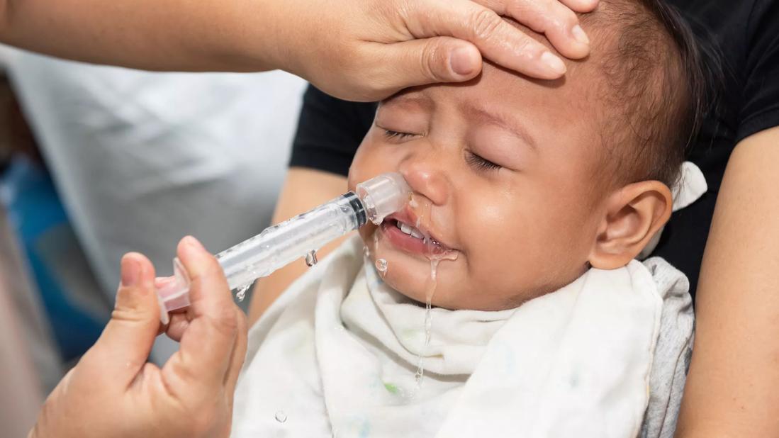 Baby getting nasal irrigation