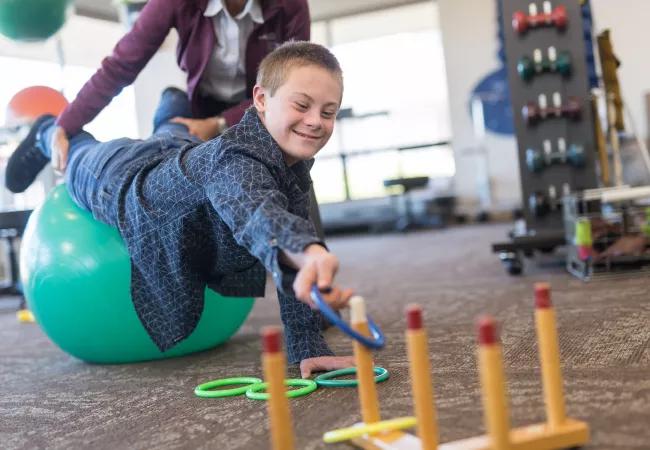 young boy in physical therapy