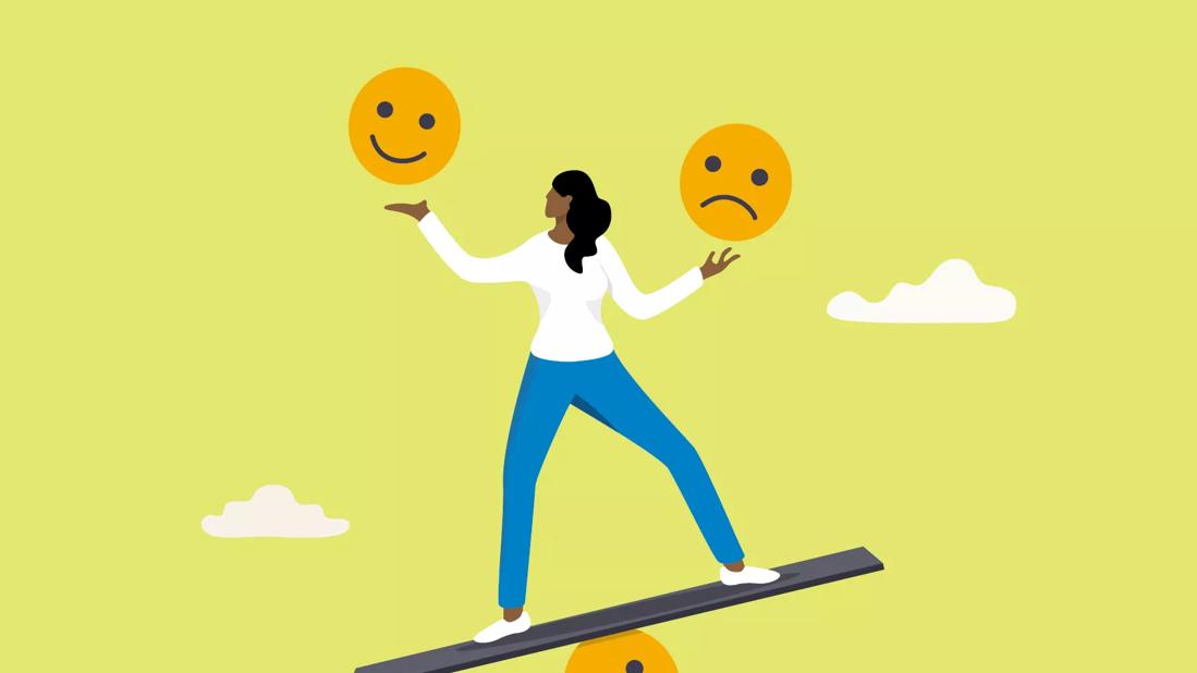 An illustration of a person trying to balance a sad face and a happy face