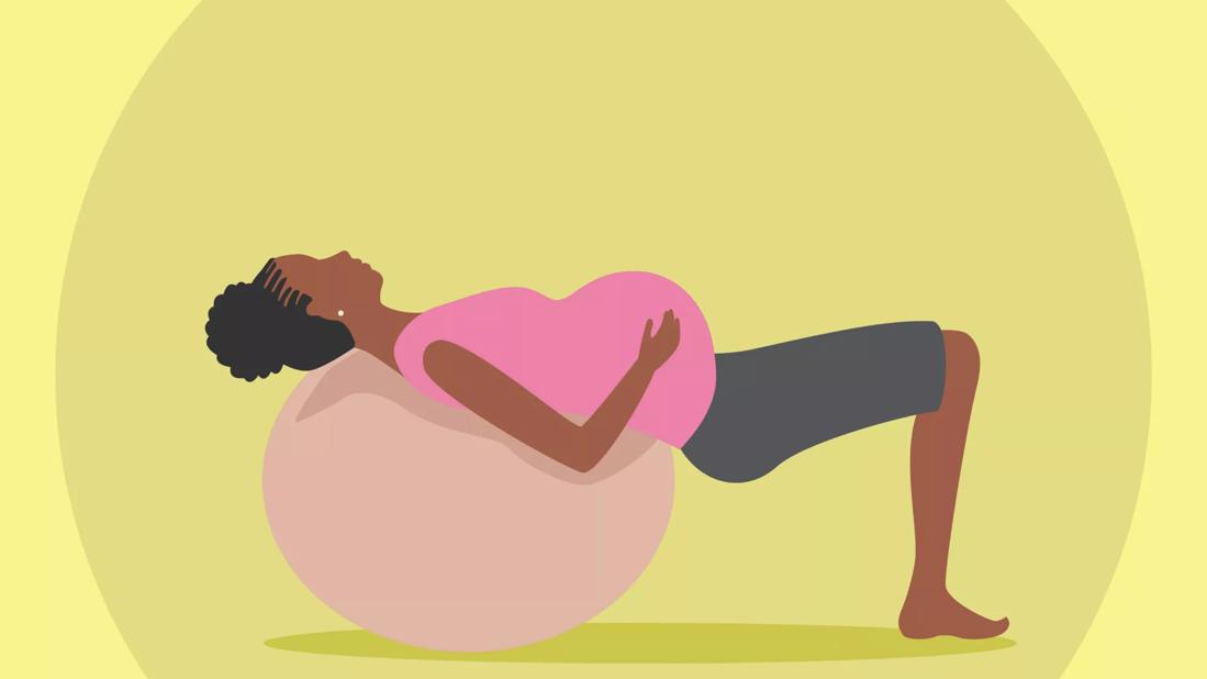 woman laying on birthing ball for exercise