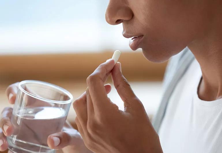 woman taking vitamin