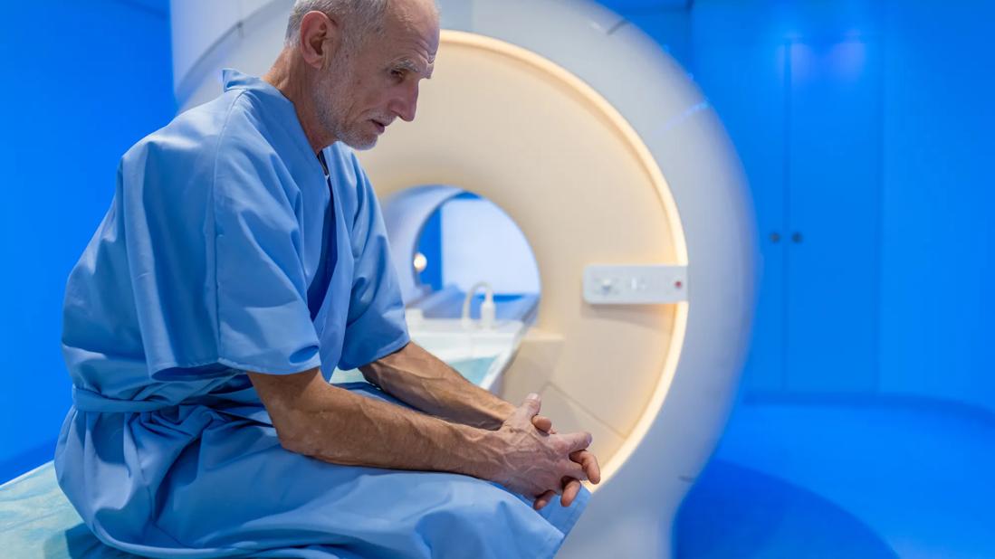 Elderly man waiting for CT scan