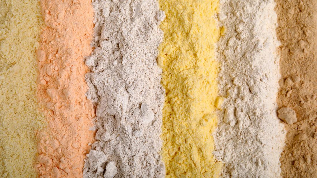 Different types of flour poured out in rows