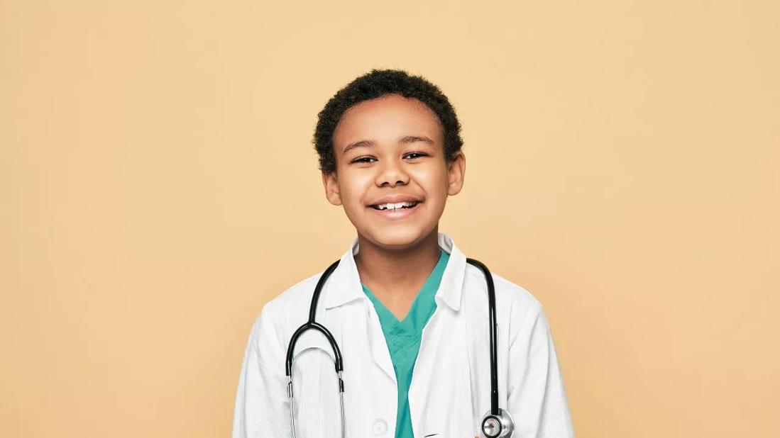 Young boy dressed as physician