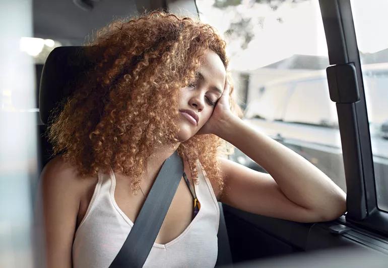 Woman sleeping in bus