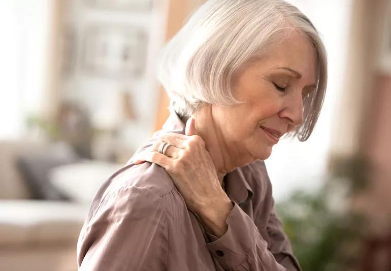 woman with persistent pain in shoulder