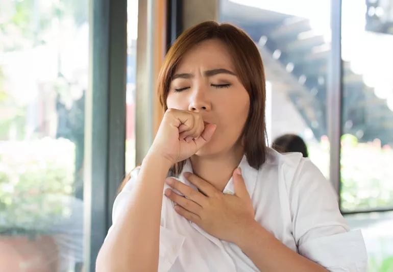 Woman having trouble swallowing
