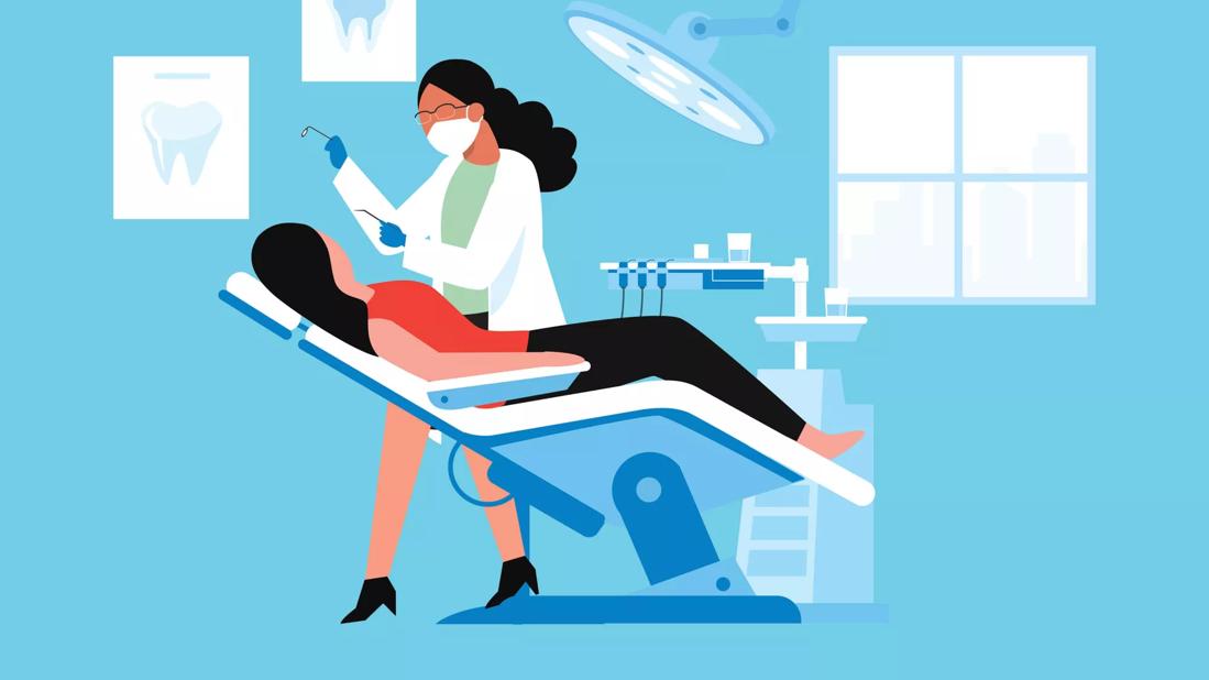 dentist working on patient in dental chair