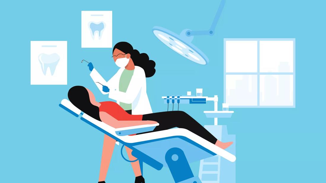 dentist working on patient in dental chair