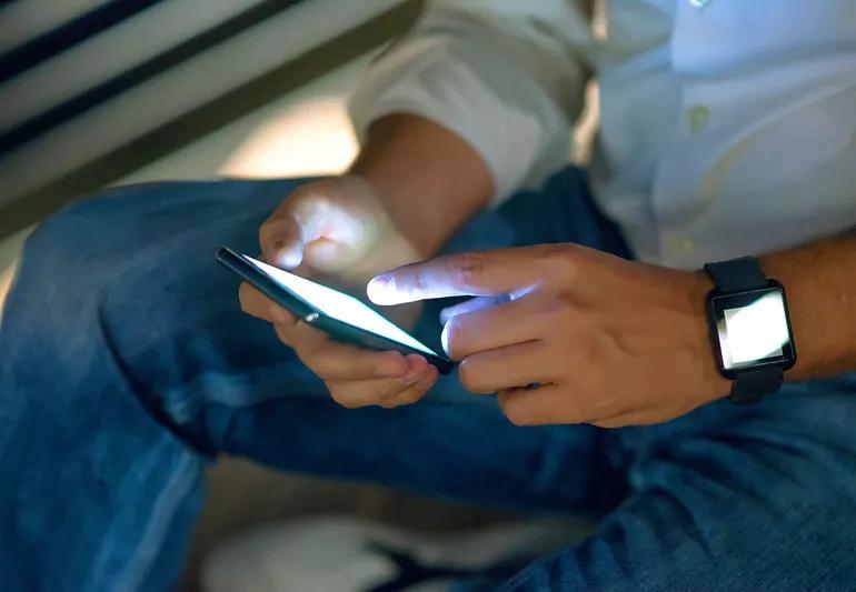 man checking email on phone