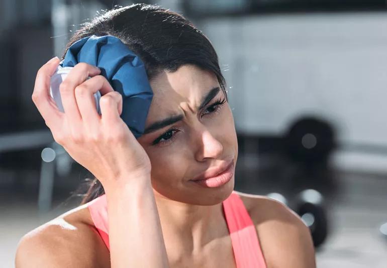 woman with ice on concussed head