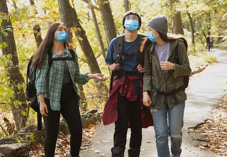 group walking outside in fall during covid