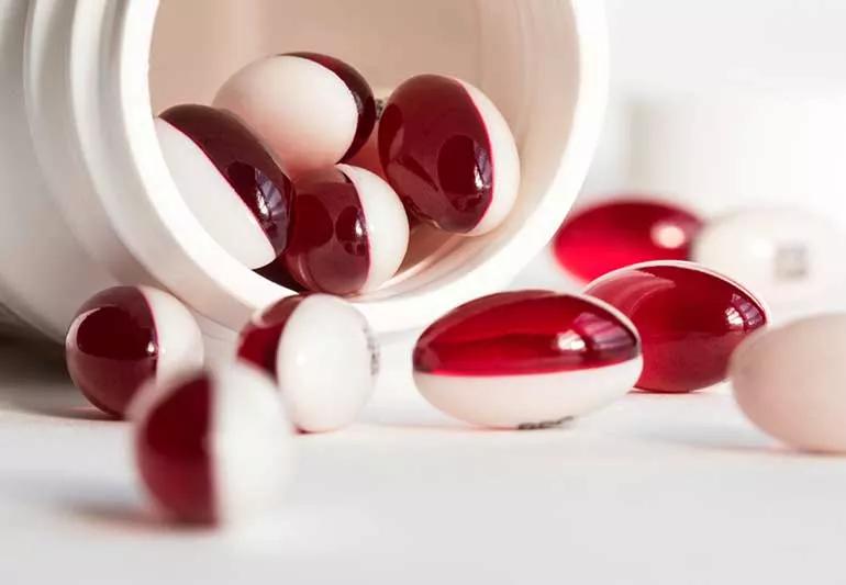 Stool softener pills on a table top.