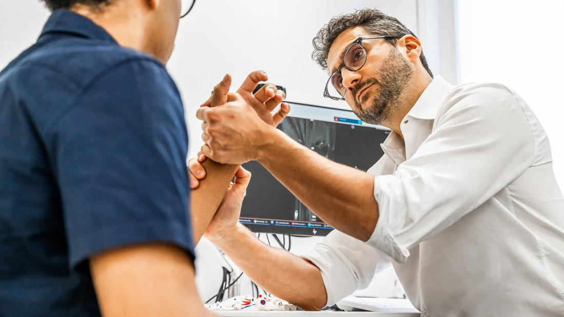 Hand surgeon with patient