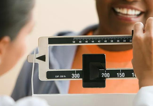 Female patient being weighed