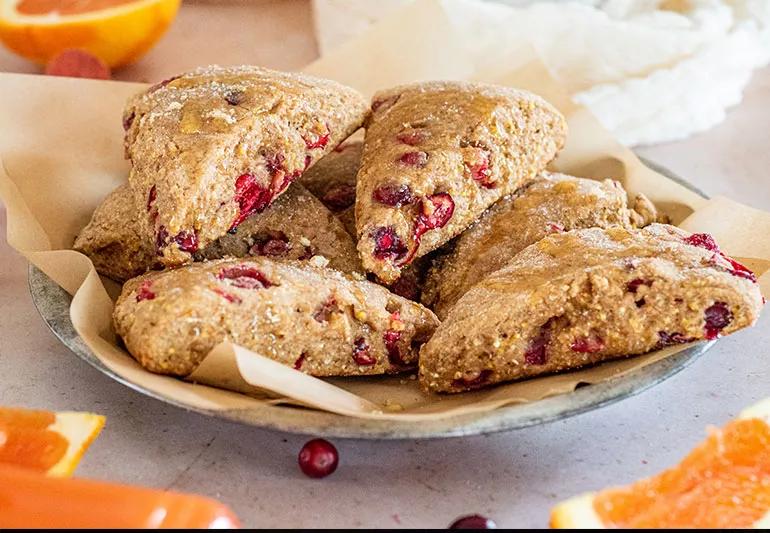 A plate of triangular-shaped whole wheat cranberry scones