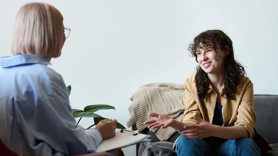 person speaking with healthcare provider in office