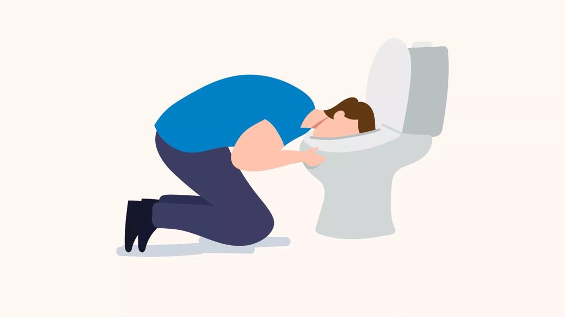 person kneeling with their head in a toilet