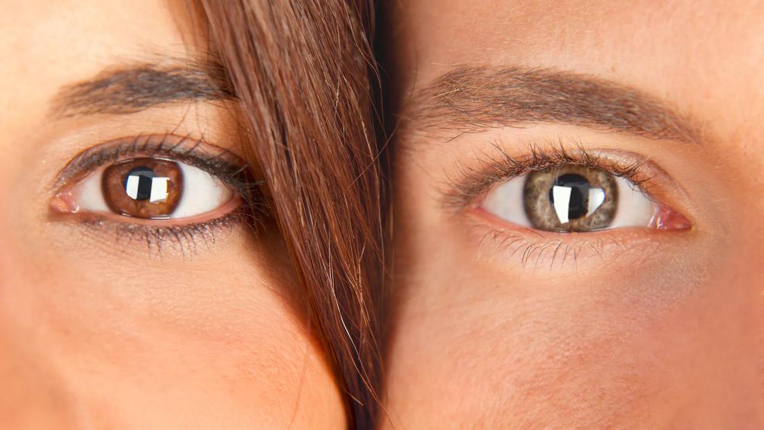 A woman's eye next to a man's eye