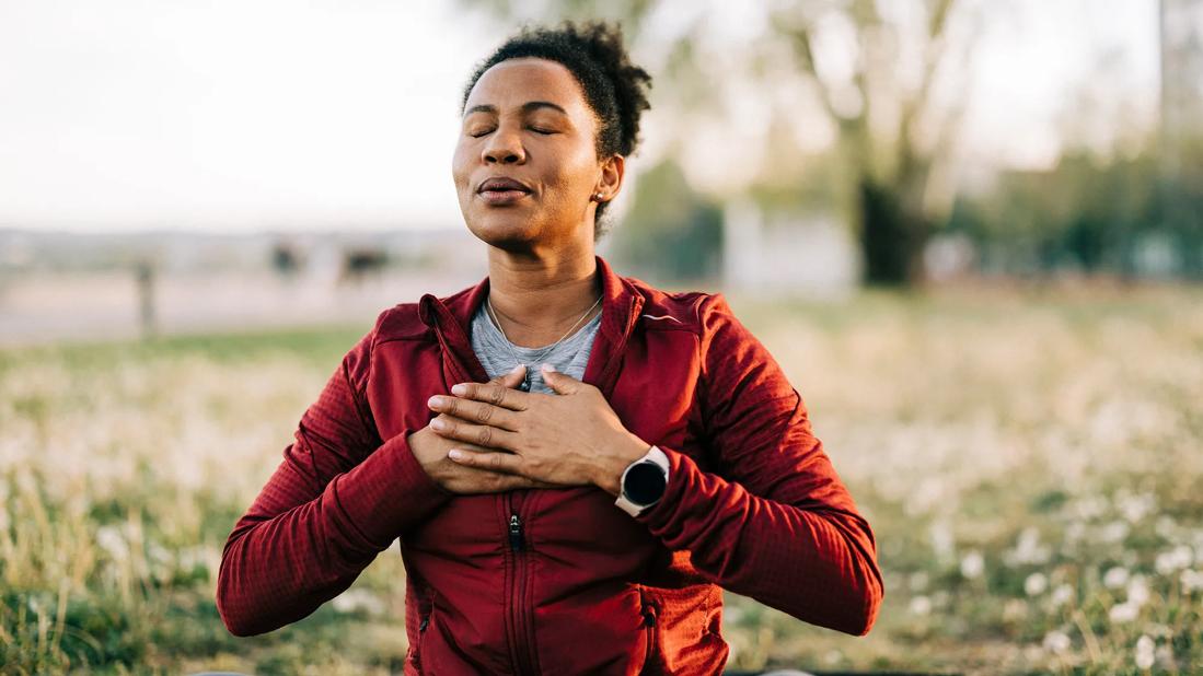 Woman meditating outside