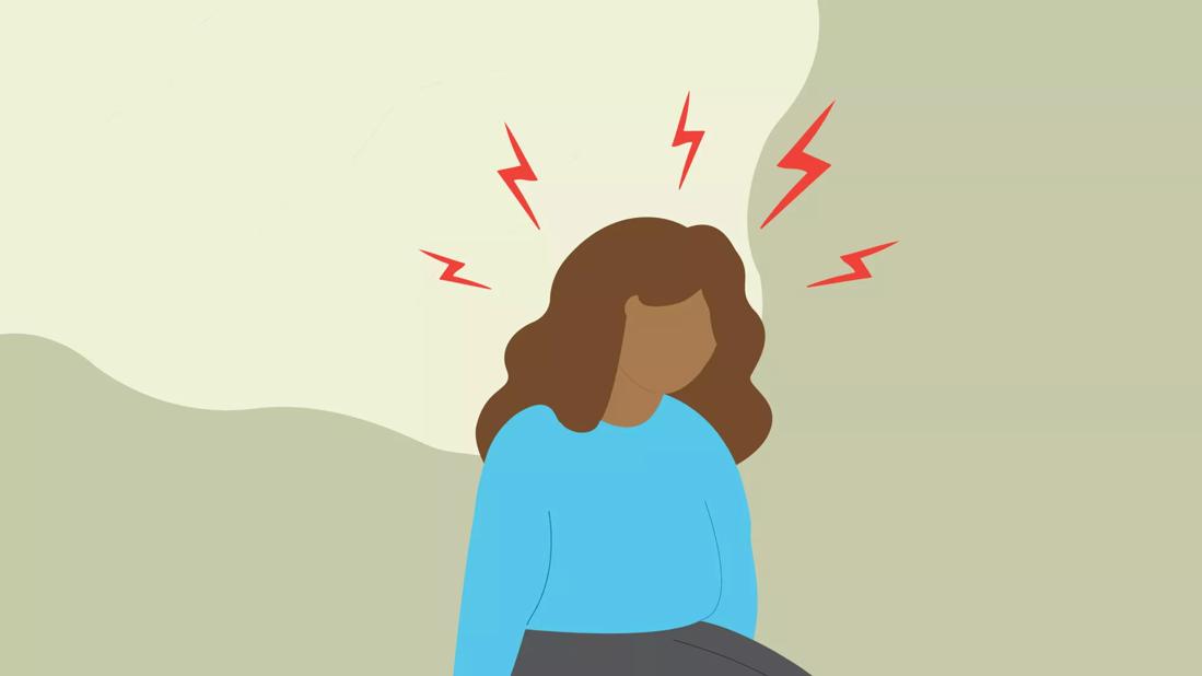 person sitting with migraine pains and visible aura