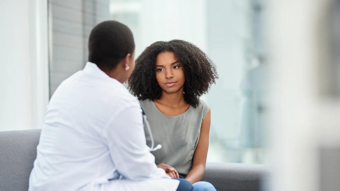 Physician speaking with patient