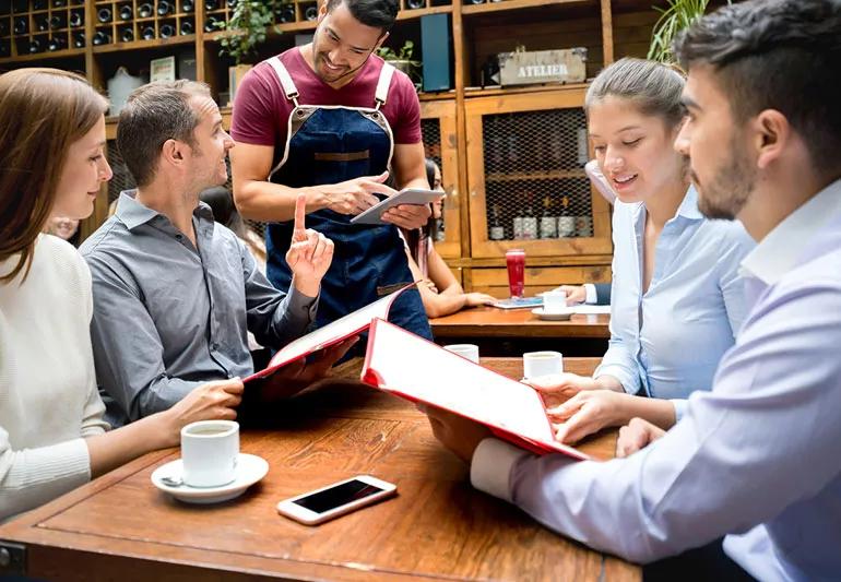 Couples at a restaurant deciding on drinks