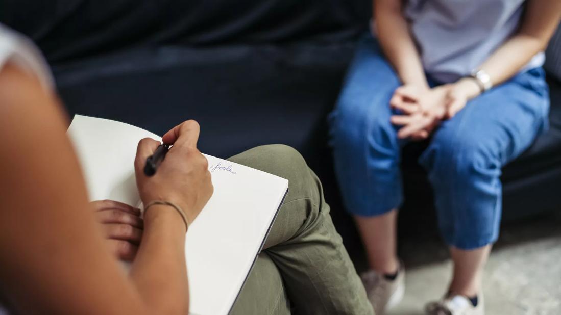 Person talking with therapist in a private setting