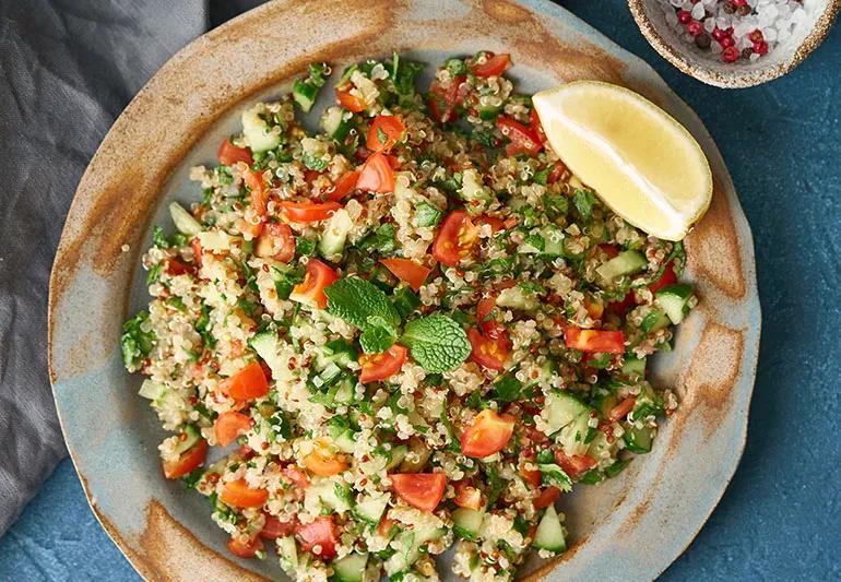A bowl of tabbouleh made with lemons and fresh herbs