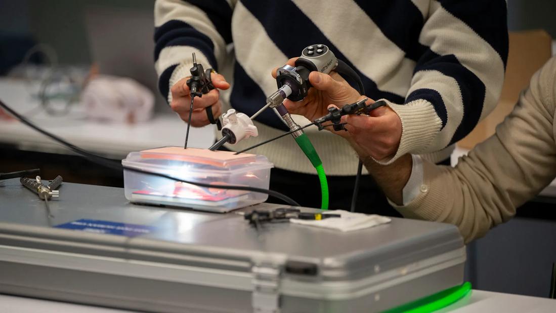 Hands holding devices in training simulation