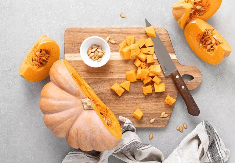 Cut pumpkin on a counter top.