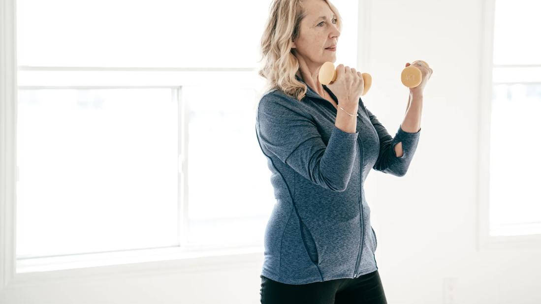Older person lifting light weights