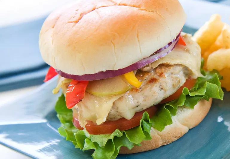 Turkey burger with onions peppers and apples