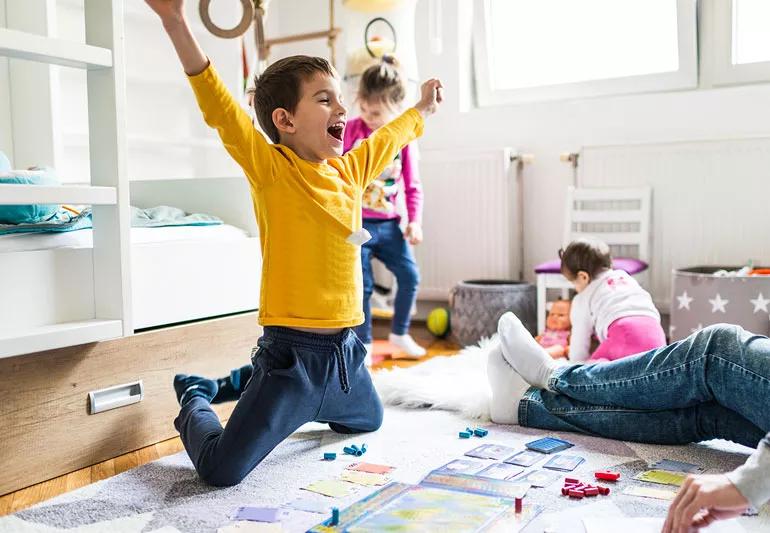 family playing board game together