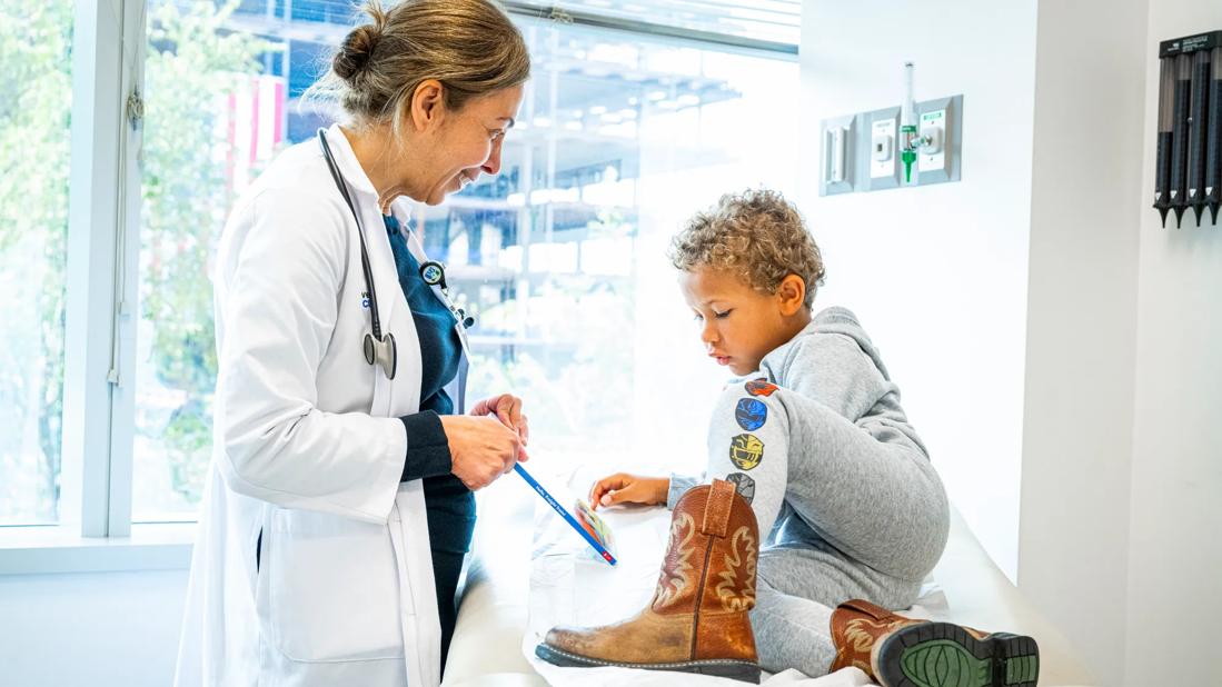Pediatrician with child