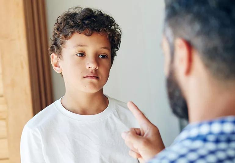 Parent lecturing misbehaving child