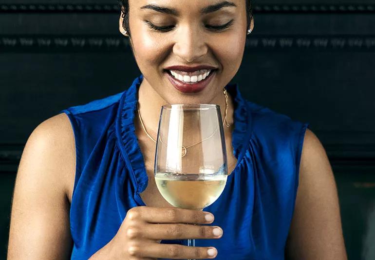 woman drinking a glass of wine