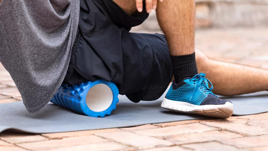 Person stretching on foam roller