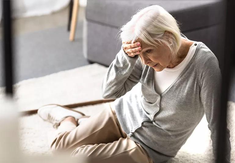 woman dizzy and has fallen down