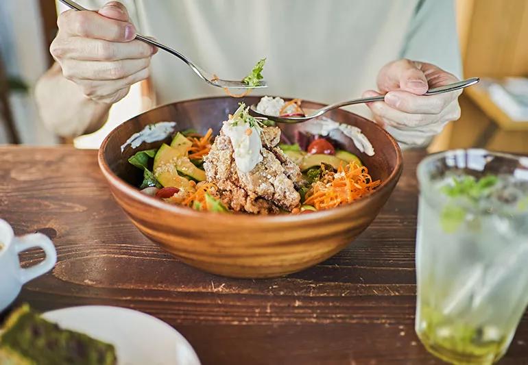 Male eating a vegan meal.