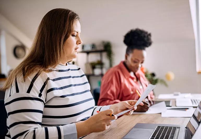 Overweight woman working in an office